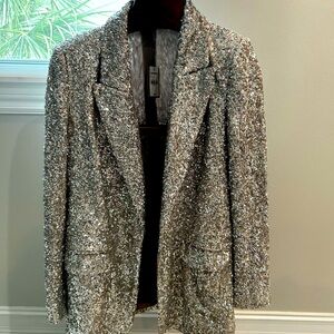 Perfect for the holidays! Stand out in this oversized, stunning blazer…